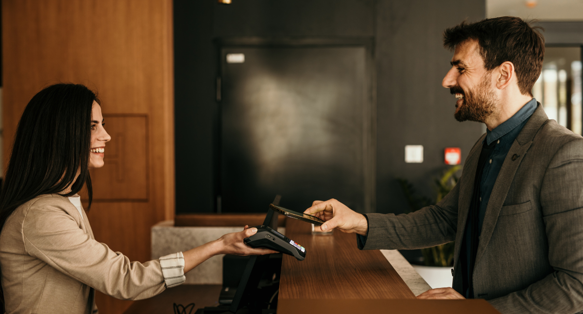 hotel guest making payment at front desk